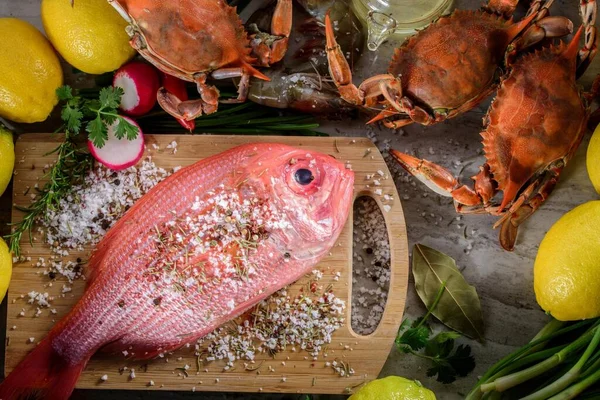 Exquisite Delights: Fresh New Zealand Red Snapper fish and Crab Infused with Salt, Spices, and Zesty Lemon in 4K