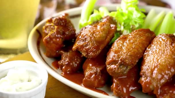 Mouthwatering Close Chicken Wings Sauce Celery Sticks — Stock Video