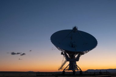 4K Ultra HD Image of Single Satellite Dish Antenna Against Sunset Sky clipart