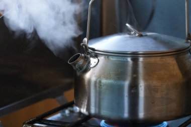 Close-Up 4K Ultra HD Image of Boiling Water in Kettle clipart