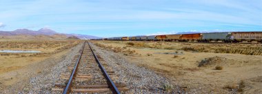 Endless Journey: 4K Ultra HD Image of Railroad Tracks in the Desert clipart