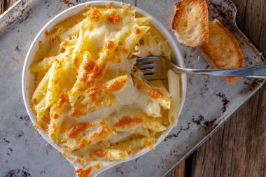 Cheesy Delight: Captivating 4K Ultra HD Picture of Baked Macaroni with Cheese in Pan clipart