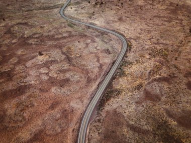  Border Journey: Aerial Drone View of Car on Road in Arid South Dakota, Bordering Wyoming, USA - 4K Ultra HD photo clipart