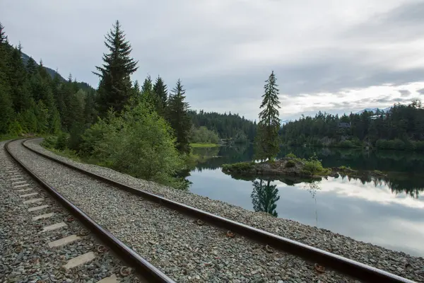stock image Stunning 4K Image: Tranquil Scene of Train Tracks Leading to Lake and Forested Island