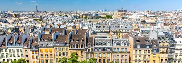 Stock image 4K Ultra HD image: Daytime View of Old Town Paris Skyline with Eiffel Tower Background