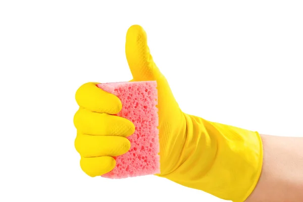 一只戴黄色手套的手拿着一块海绵 用白色的背景隔开 女用洗碗用的海绵 — 图库照片