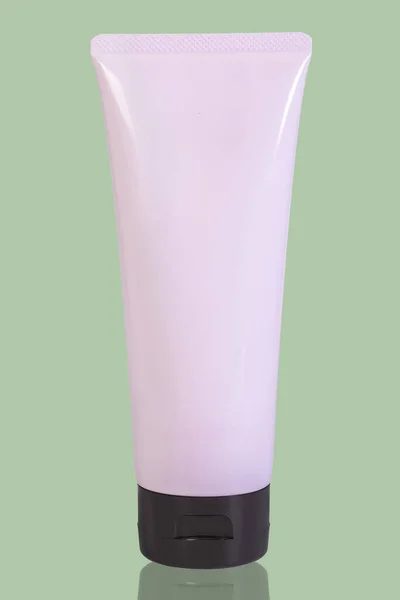 Tubo Rosa Crema Gel Sfondo Verde Con Riflesso — Foto Stock