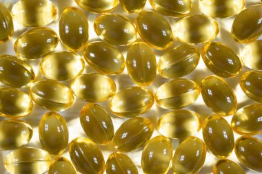 Omega-3 balık yağı kapsülleri. Sağlık hizmeti konsepti. Yakın plan, D vitamini, arkaplan, üst görünüm.