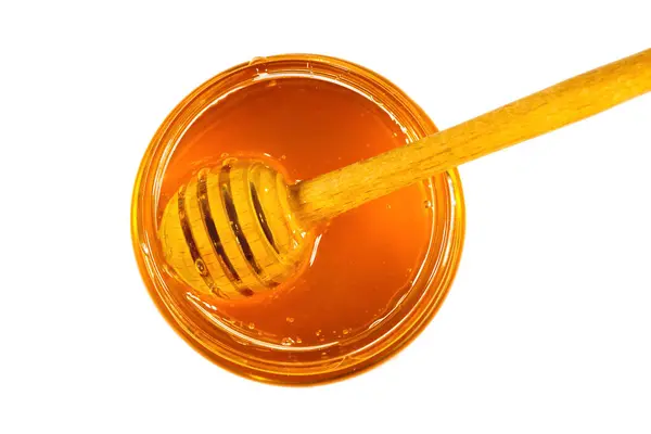 Glazen Pot Vol Honing Dipper Geïsoleerd Witte Achtergrond Bovenaanzicht — Stockfoto