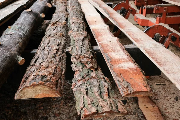 Wooden planks from logs in the sawmill warehouse.