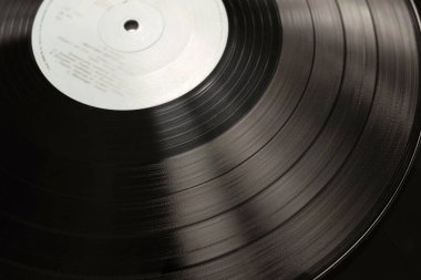 Vinil disk yakın plan. Vinil kayıt dokusu klasik tarzda.