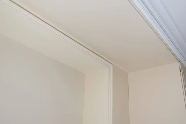 Ceiling moldings in the interior, detail of corner.
