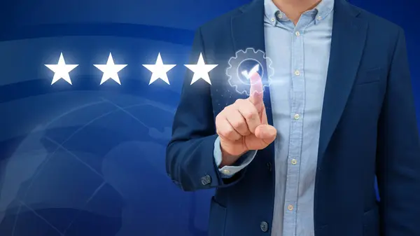 Business man touches the touch screen with five stars. ISO quality assurance. Wireless connection technology. Global network and data exchange in human hands.