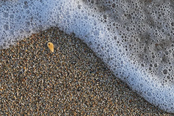Kies Strand Stein Sand Und Meeresschaum — Stockfoto