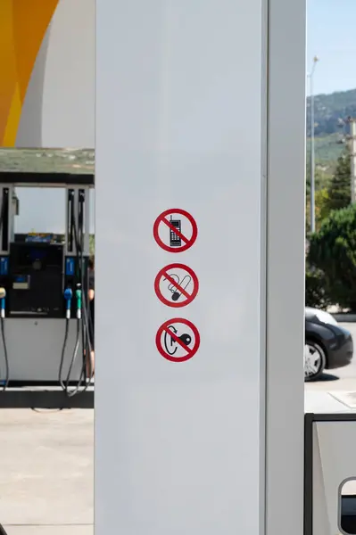 Safety warning signs at the petrol station.