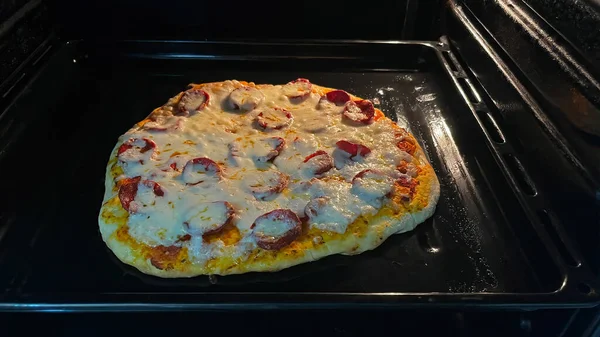 Oven-baked pepperoni and cheese pizza.
