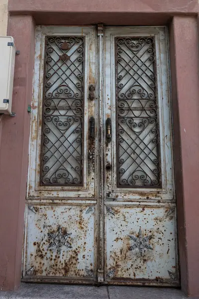 The old iron gate of a house.