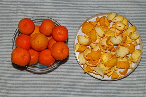 Citrus fruits and sliced peel for making jam.