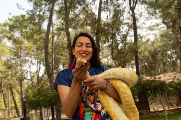 Woman holding snake Stock Photos, Royalty Free Woman holding snake ...