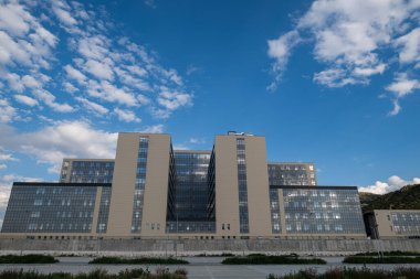 Burdur, Turkey - May 13, 2024: View of the Burdur state hospital building. Cloudy and blue sky background. clipart