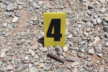 Boş tüfek fişeği ve kanıt işareti..