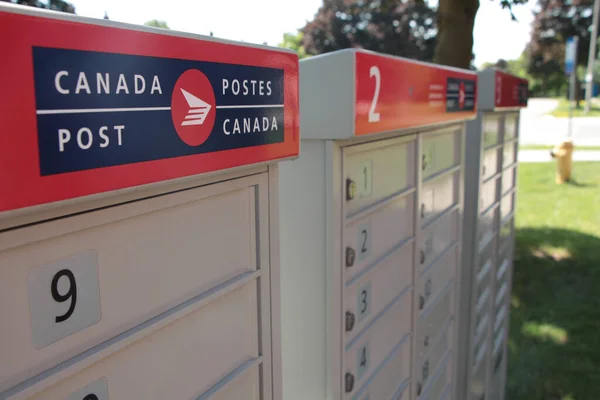 Three Canada Post Community Mailboxes Logo Top Frame Left Street — Stock Photo, Image