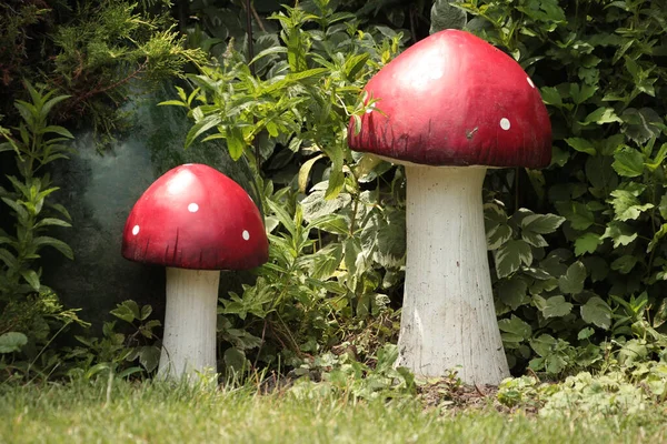 Two Tall Red White Mushroom Statues One Taller Other Grass — Stock Photo, Image