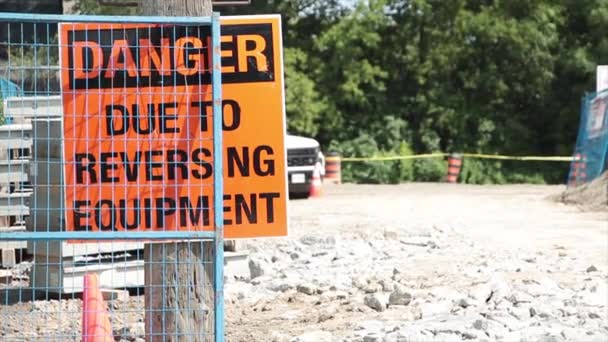 Danger Due Reversing Equipment Sign Wood Post Dirt Parking Lot — Stock Video
