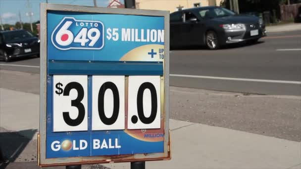 Lotto 649 Million Dollars Thirty Dollars Gold Ball Logo Sign — Stock Video