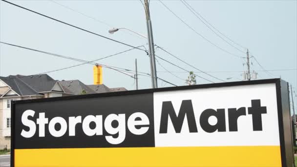 Storage Mart Sign Power Lines Cables Traffic Light Calm Road — Stock Video
