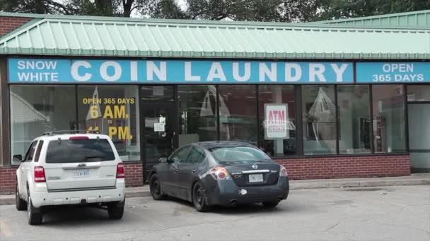 Coin Laundry Open 365 Days Laundromat Storefront Windows Cars Vehicles — Stock Video