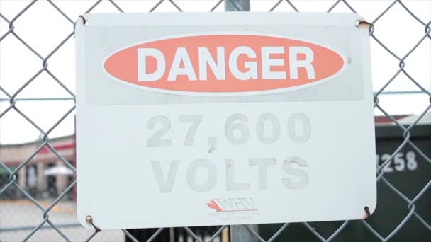 Danger 27600 Volts Red Black White Faded Worn Sign Silver — Stock Video