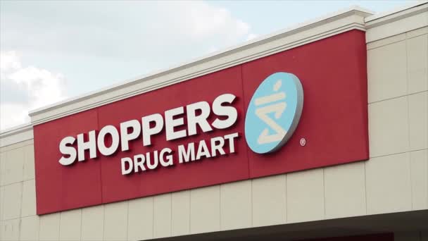 Shoppers Drug Mart Pharmacy Franchise Chain Parking Lot Sign Logo — Stock Video