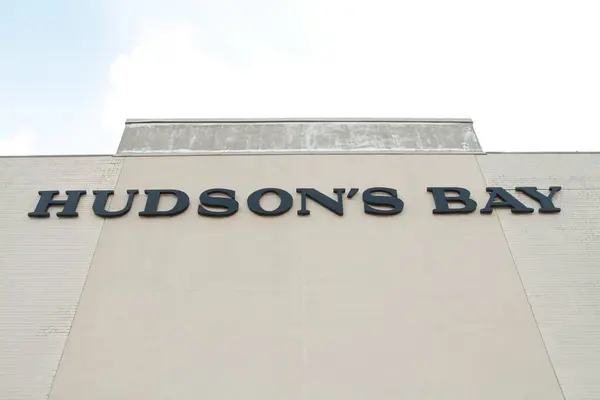 stock image hudsons bay department store sign logo on on store wall with sky in background, close up