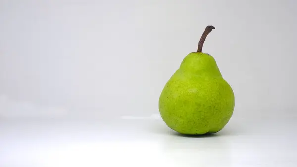 stock image Packham pear, green pear, Packham's Triumph Pear with science name Pyrus communis on white background