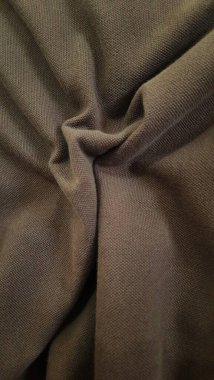 Doğal pamuk ya da keten kumaş dokusu. Doğal bej ya da kahverengi kumaşın yakın çekim dokusu. Bej tuval arkaplanı.