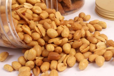 Fried peanuts on a white background clipart
