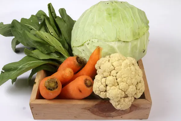 vegetables in the box on wooden table background