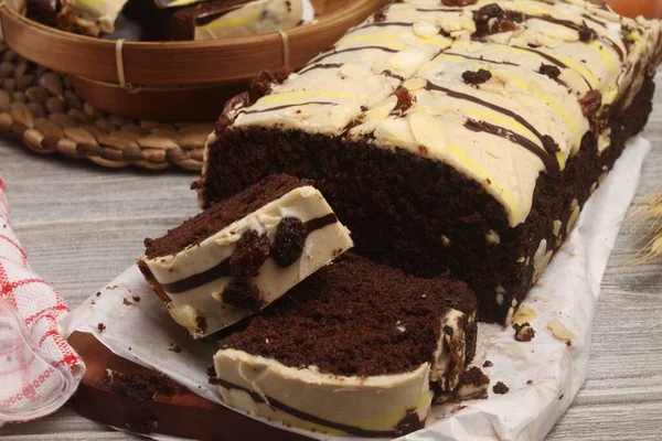 chocolate cake with cream, whipped cream, chocolate and chocolate