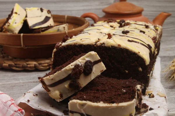 chocolate cake with cream, whipped cream, chocolate and chocolate