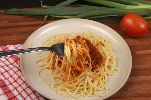 spaghetti with tomato sauce and fork