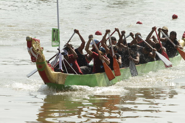 Pekalongan, Indonesia- April 24, 2023 : traditional boat rowing competition festival