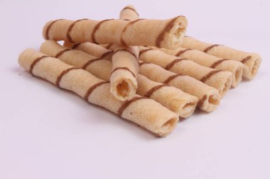 egg roll biscuits on white background clipart