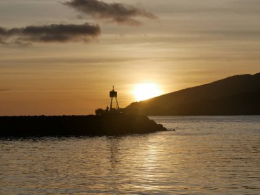 Sunset of Trois Rivieres port in Basse Terre, Guadeloupe. Caribbean sunset clipart