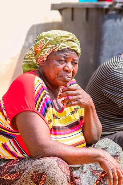 stock image Abuja, Nigeria - January 09, 2023: African Patients Receiving Consultation outdoors in a Village. One on One Counselling Session with a Therapist in a Local Community.