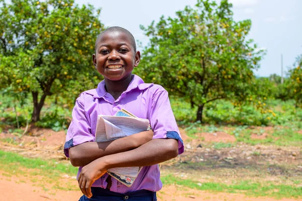 stock image Abuja, Nigeria - June 12, 2023: Portrait of African Children Young Students Learning in a Rural Community. Smiling African Children Wearing School Uniform. Education in African.