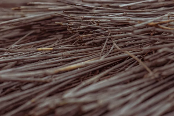 Stock image black wooden background of many sticks 