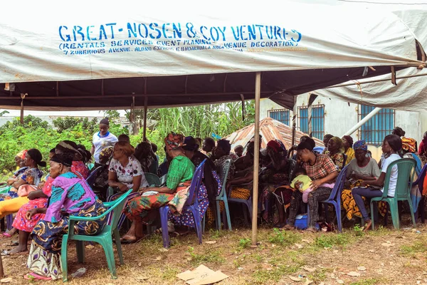 stock image Aluu, Port Harcourt, Nigeria - August 10, 2021: African People Waiting on a Queue for Medical Care and Attention in a Rural Community