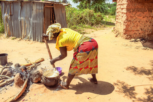 Opialu, Benue State - March 6, 2021: Hardworking African Woman engaged in her Activity in her Community
