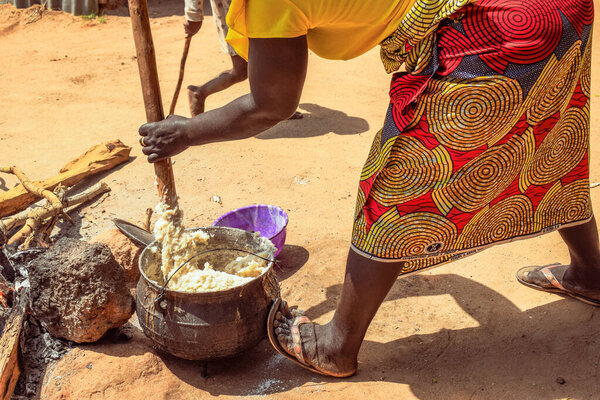 Opialu, Benue State - March 6, 2021: Hardworking African Woman engaged in her Activity in her Community